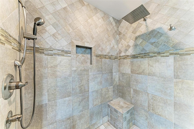 bathroom featuring a tile shower