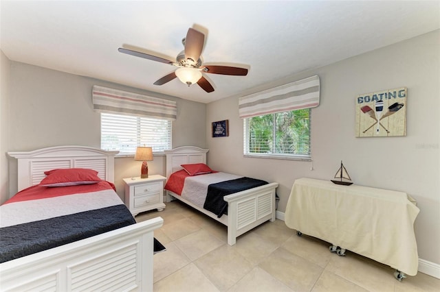 bedroom with light tile patterned floors and ceiling fan