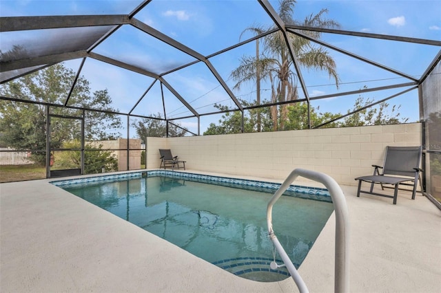 view of pool featuring a lanai and a patio