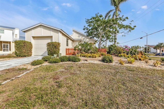 view of front of home featuring a garage and a front yard