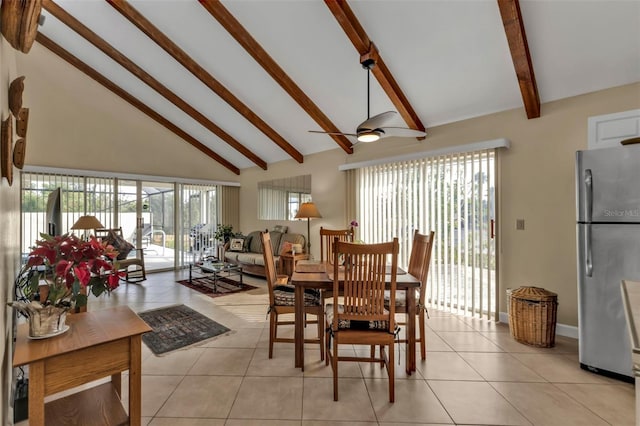 tiled dining space with ceiling fan, a wealth of natural light, beamed ceiling, and high vaulted ceiling