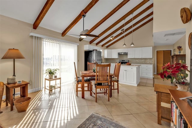 tiled dining space with high vaulted ceiling, beam ceiling, and ceiling fan