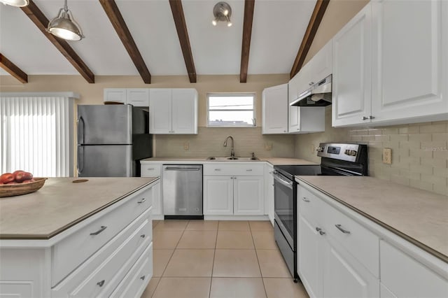 kitchen featuring sink, white cabinets, appliances with stainless steel finishes, and vaulted ceiling with beams