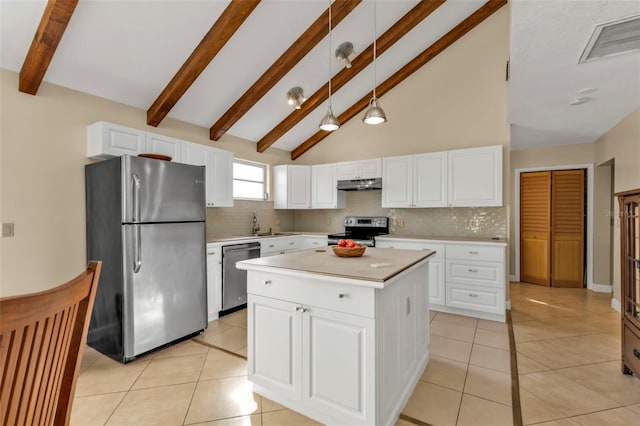 kitchen featuring a center island, appliances with stainless steel finishes, tasteful backsplash, white cabinetry, and decorative light fixtures