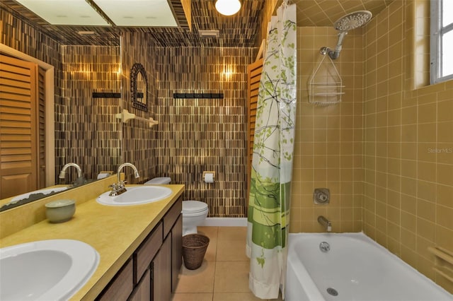 full bathroom with vanity, toilet, tile patterned floors, and shower / bath combo with shower curtain