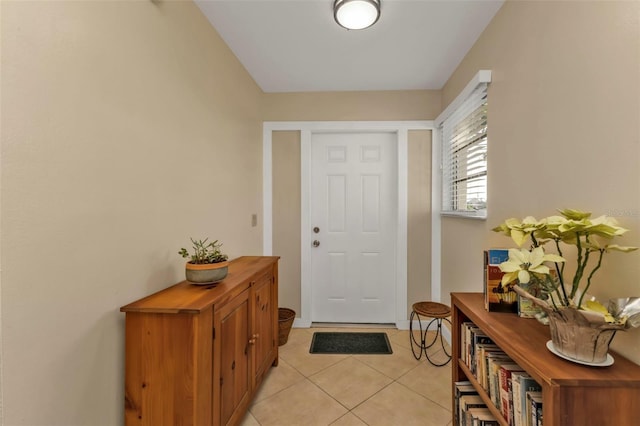 doorway to outside featuring light tile patterned floors