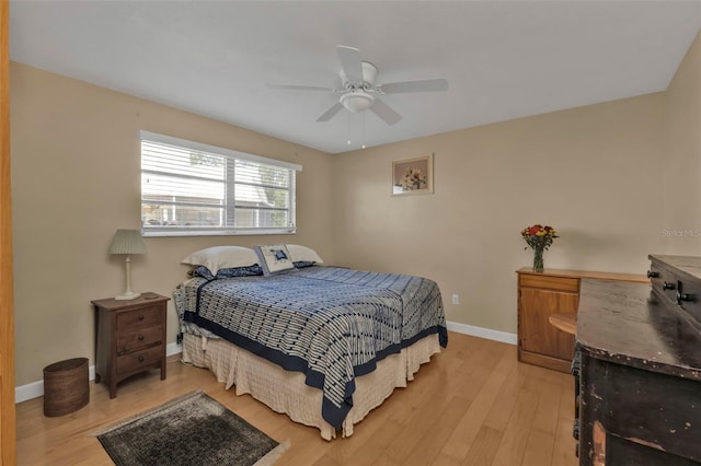 bedroom with light hardwood / wood-style flooring and ceiling fan