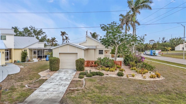 view of front of house with a front yard and a garage