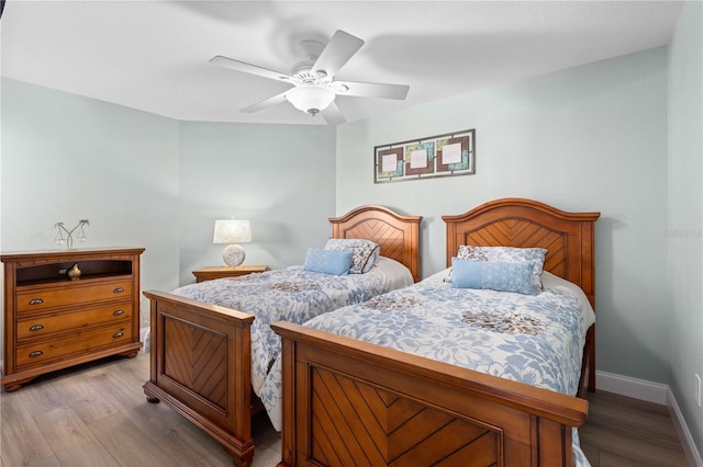 bedroom with ceiling fan and light hardwood / wood-style flooring