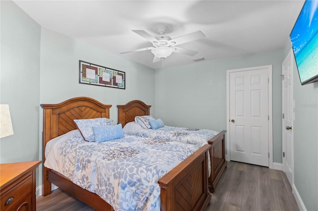 bedroom with hardwood / wood-style floors and ceiling fan