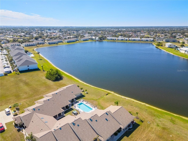 birds eye view of property with a water view