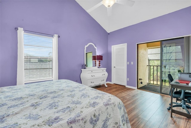 bedroom featuring high vaulted ceiling, dark hardwood / wood-style flooring, access to outside, ceiling fan, and a closet