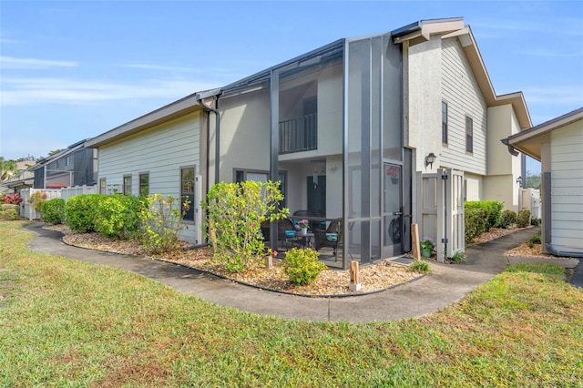 view of side of property with a yard