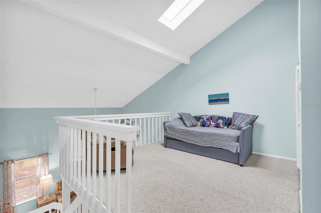 bedroom with vaulted ceiling with skylight and carpet