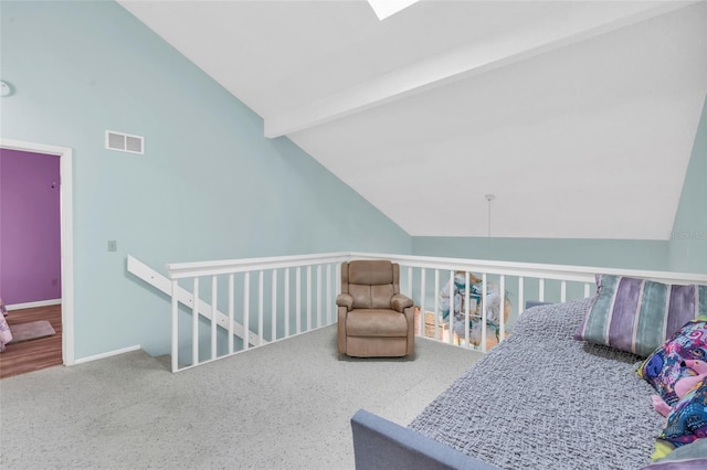 bedroom featuring carpet floors and lofted ceiling with beams