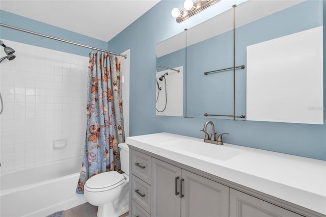 full bathroom with shower / tub combo, vanity, and toilet