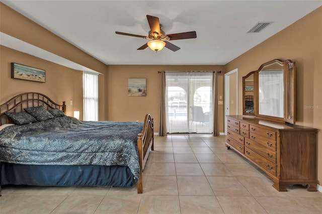 tiled bedroom featuring ceiling fan and access to outside