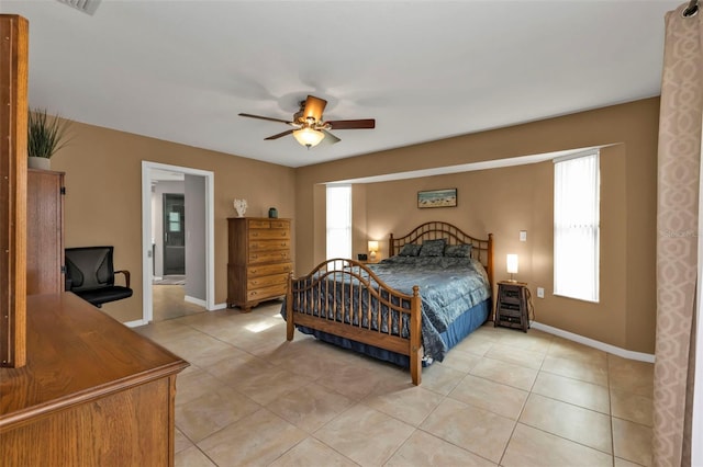 bedroom featuring ceiling fan and light tile patterned flooring