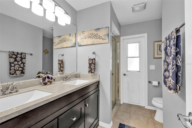 bathroom with a shower with door, toilet, tile patterned flooring, and vanity