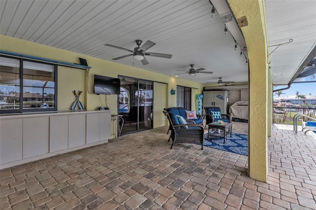 view of patio / terrace with ceiling fan and an outdoor hangout area