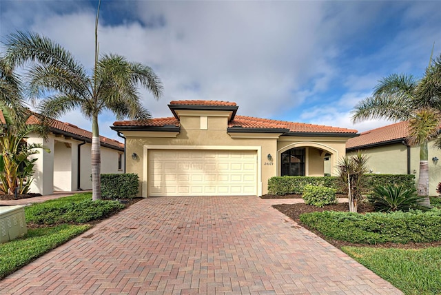 mediterranean / spanish-style house featuring a garage