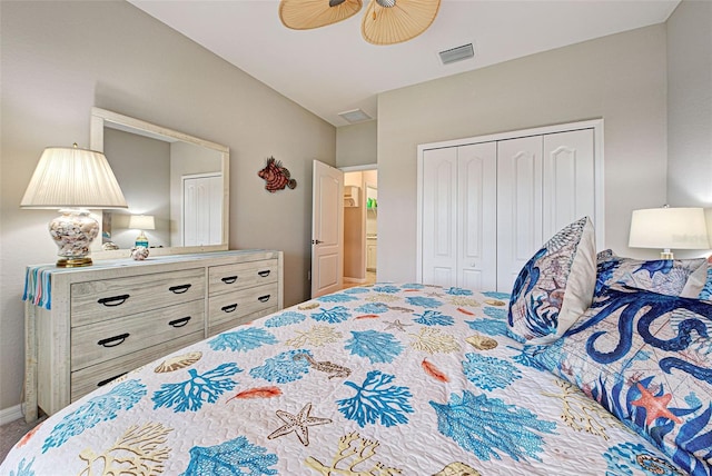 carpeted bedroom featuring ceiling fan and a closet