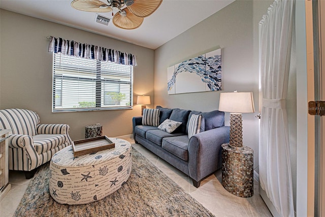 tiled living room with ceiling fan