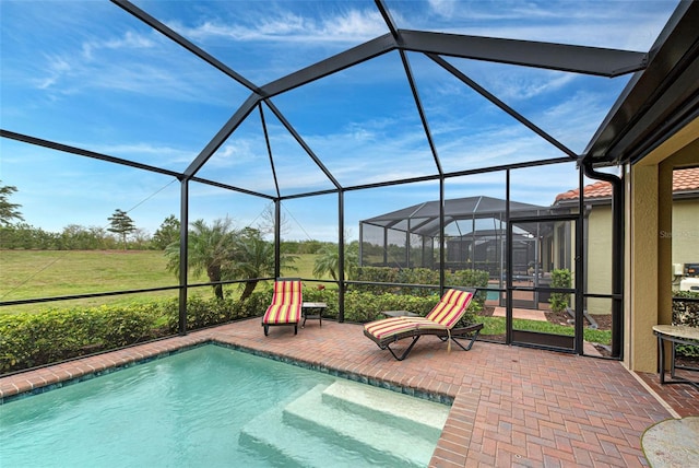 view of pool featuring a patio and a lanai