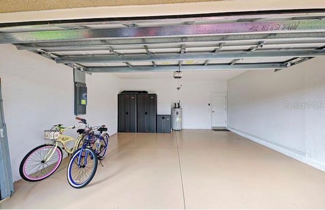 garage with electric panel, water heater, and a garage door opener