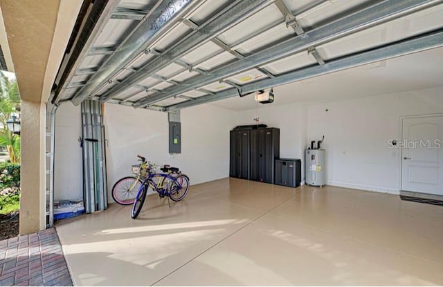 garage featuring a garage door opener and electric water heater