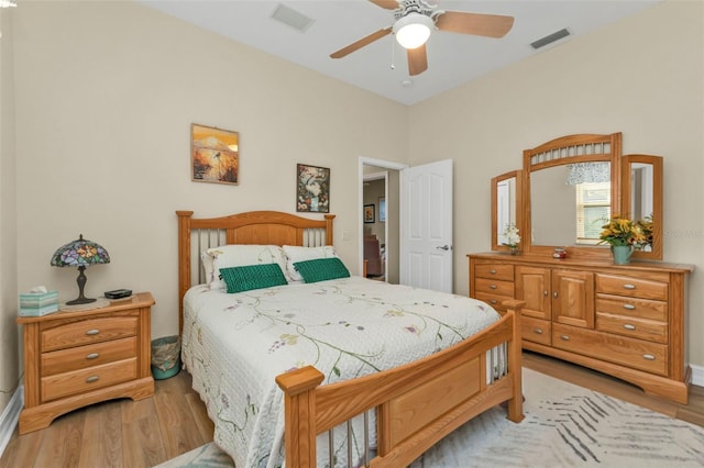 bedroom featuring light hardwood / wood-style flooring and ceiling fan