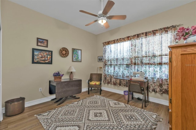 sitting room featuring hardwood / wood-style flooring and ceiling fan