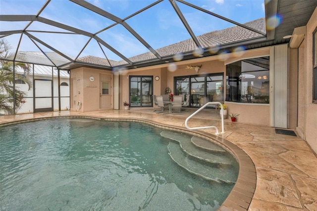 view of swimming pool featuring a patio and glass enclosure