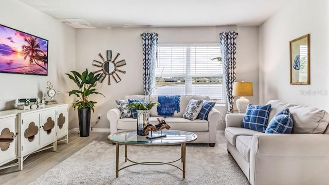 living room with light hardwood / wood-style flooring