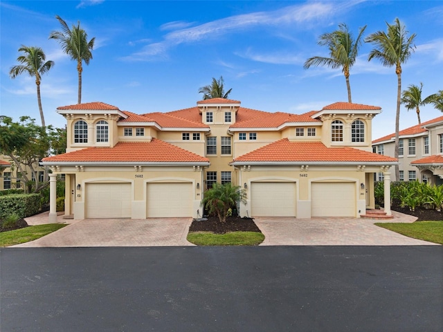 mediterranean / spanish house featuring a garage