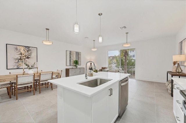 kitchen with decorative light fixtures, white cabinetry, sink, a kitchen island with sink, and stainless steel dishwasher