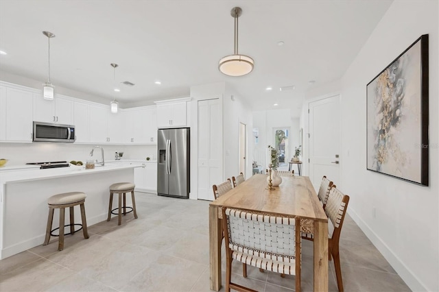 dining space with sink