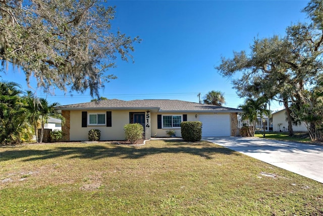 single story home featuring a garage and a front lawn