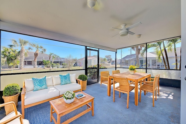 sunroom / solarium with ceiling fan