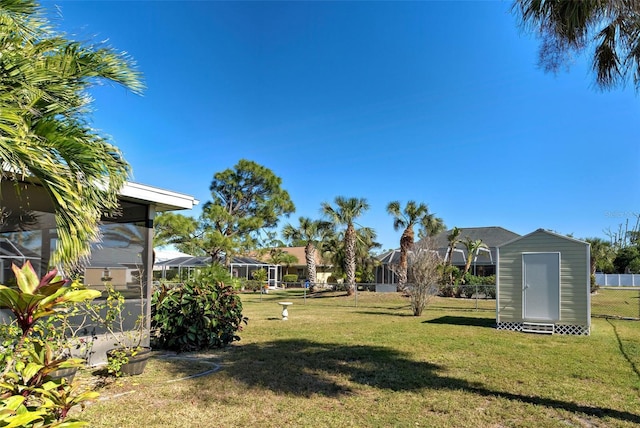 view of yard with a storage unit