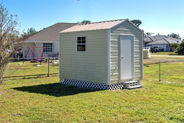 view of outbuilding featuring a yard