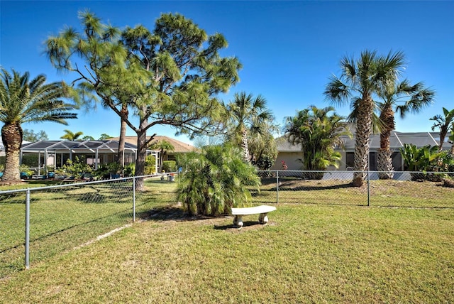 view of yard featuring glass enclosure