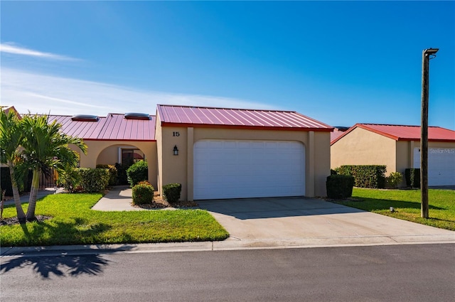 view of front facade featuring a garage and a front yard