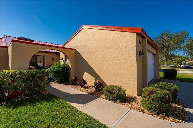 view of side of property with a garage