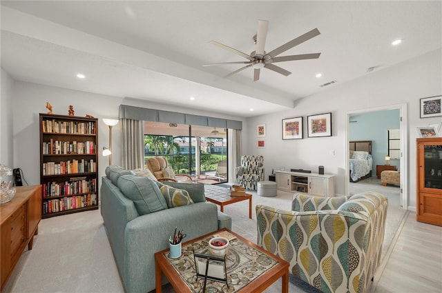 living room with ceiling fan and light hardwood / wood-style flooring