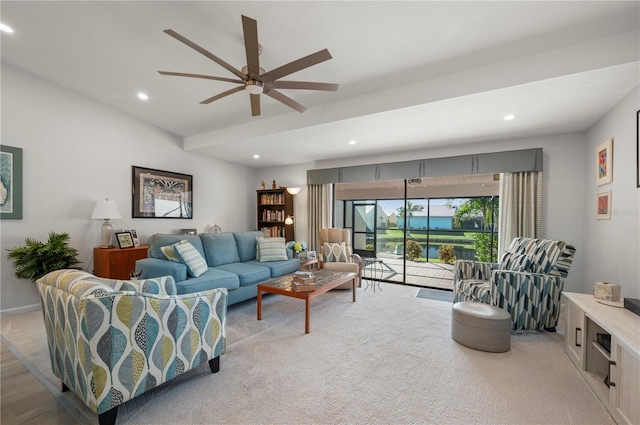 living room featuring light colored carpet and ceiling fan