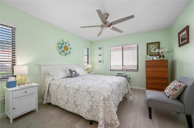 bedroom featuring ceiling fan and light wood-type flooring