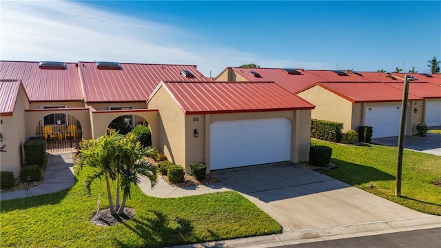 view of front facade with a garage and a front yard