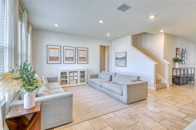 living room featuring a textured ceiling