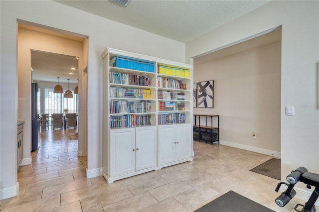 interior space featuring a textured ceiling